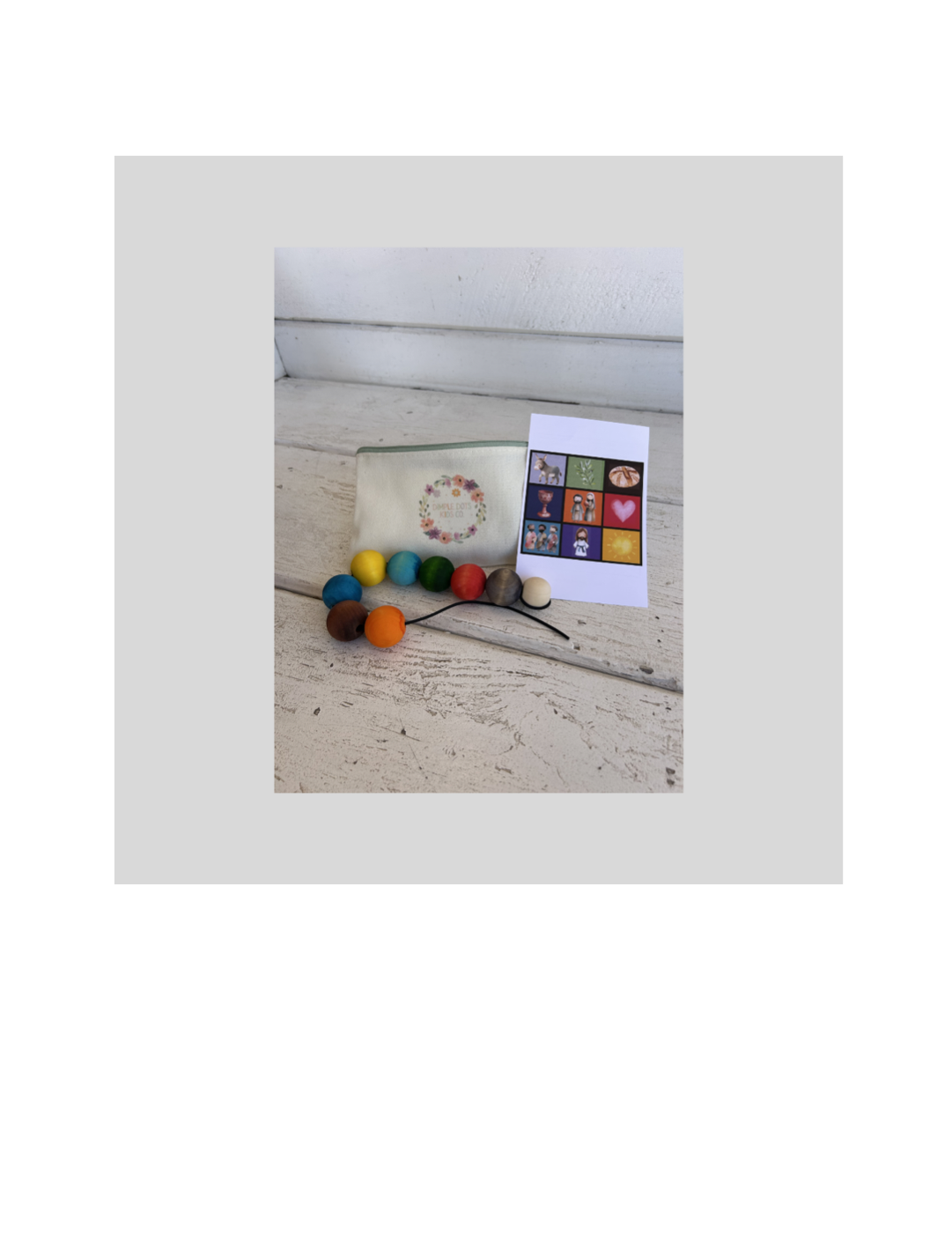 Easter Story Lacing Bead Set with colorful beads, card, and pouch arranged on a neutral tabletop