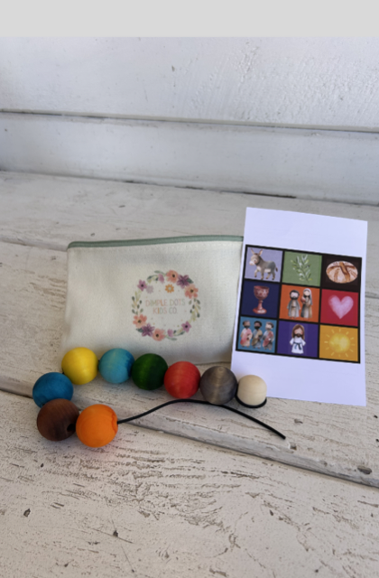 Easter Story Lacing Bead Set with colorful beads, card, and pouch arranged on a neutral tabletop